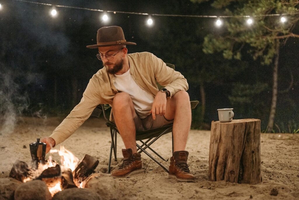 Lightweight camping chairs at a picturesque outdoor campsite.